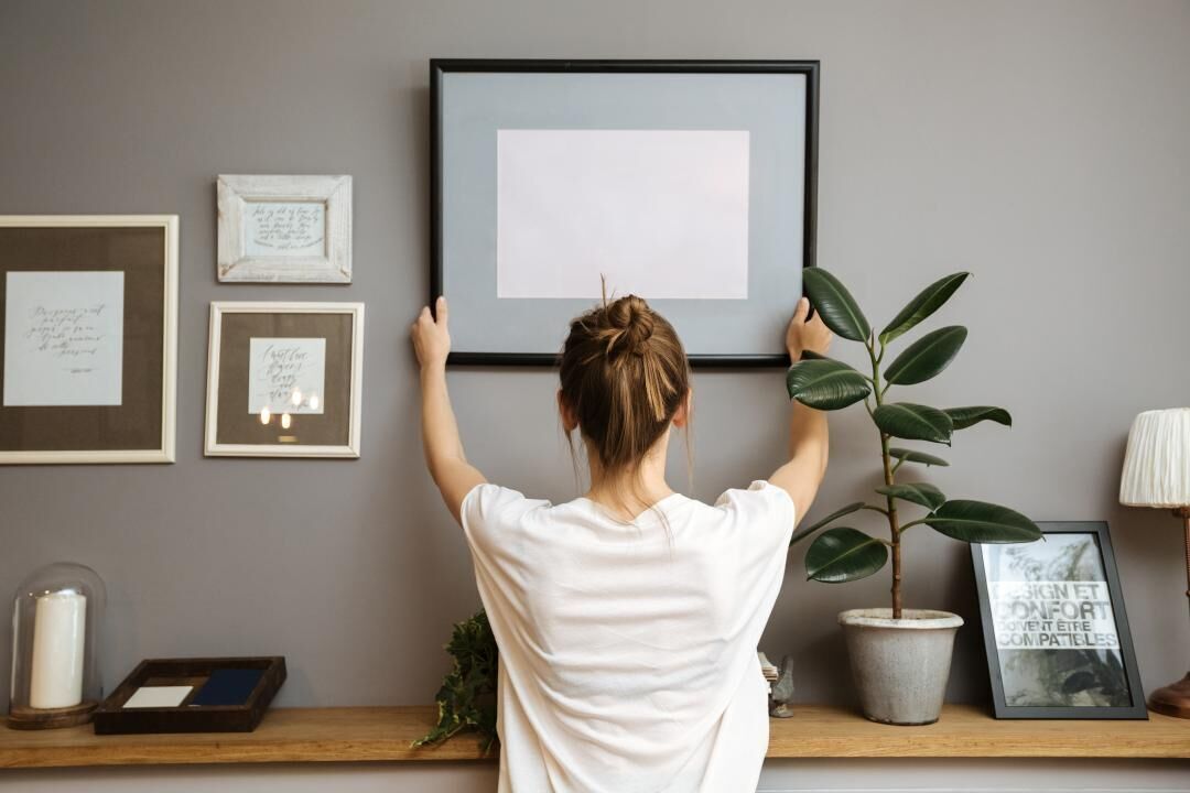 Hang wall decorations higher than eye level